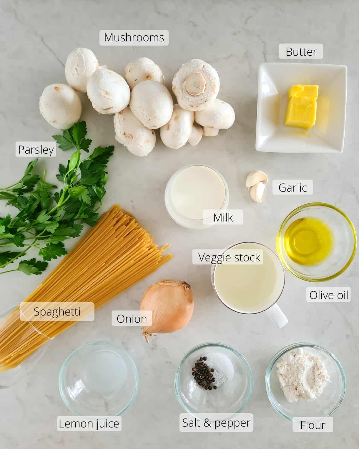 Overhead shot of all ingredients required for creamy mushroom pasta