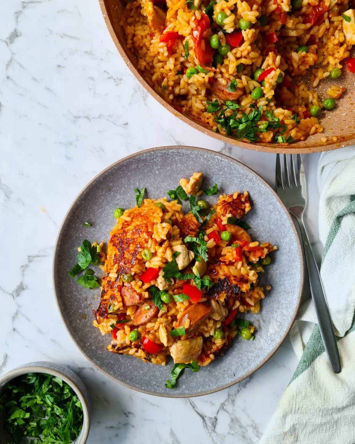 A plate of chicken and chorizo paella