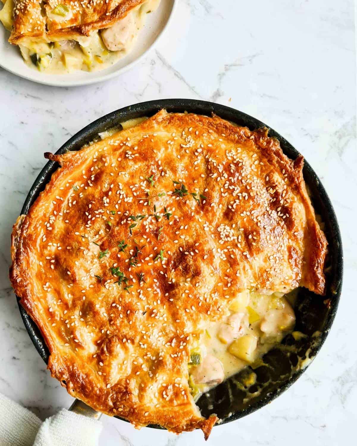 chicken pot pie with one serving being scooped out