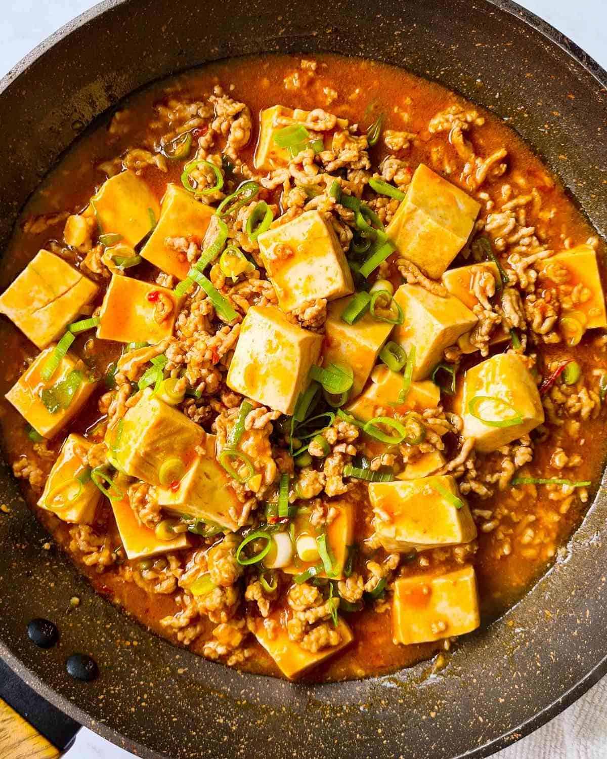 Freshly cooked mapo tofu in a non-stick pan