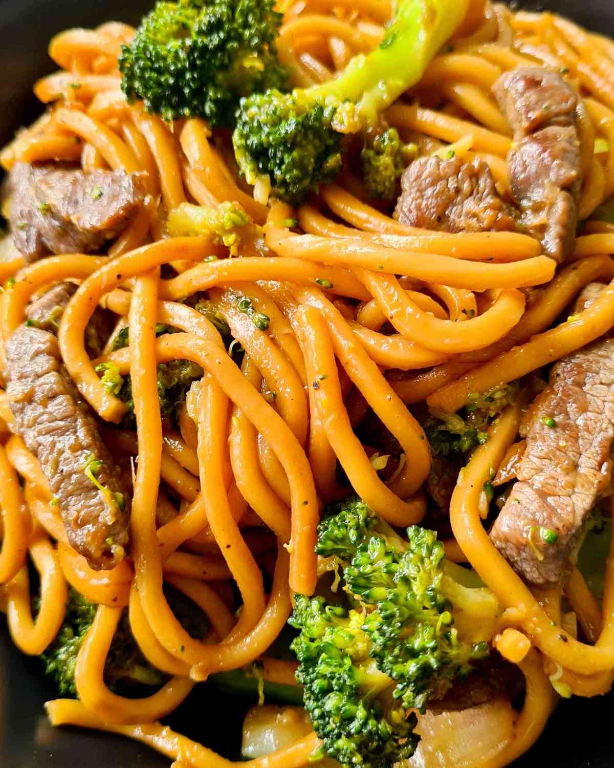 Close up of noodles, beef and broccoli