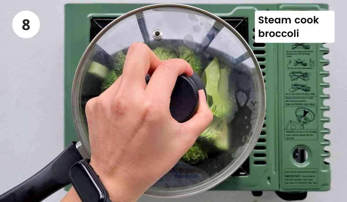 cooking broccoli in a saucepan with caption