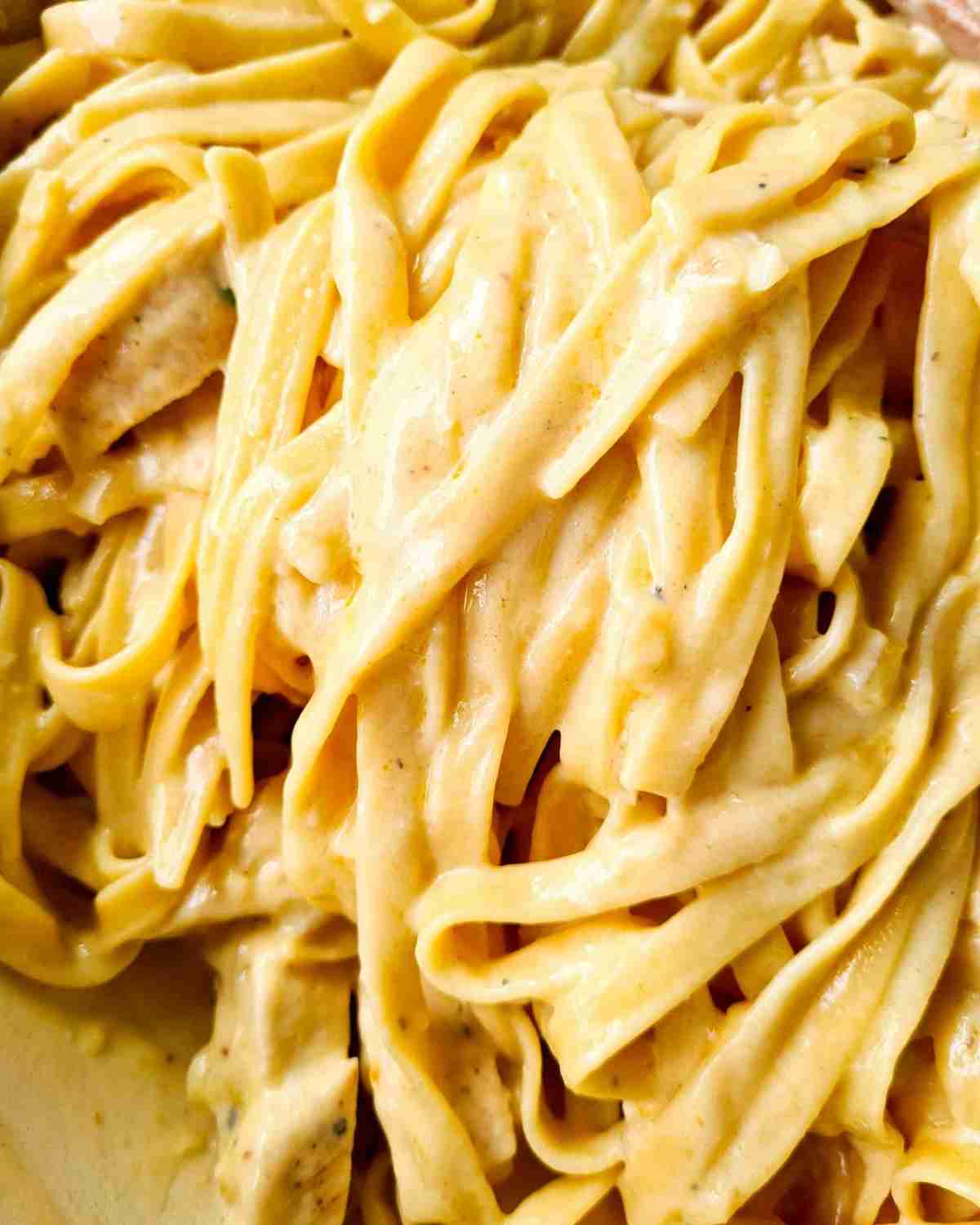 Close up of golden creamy pasta