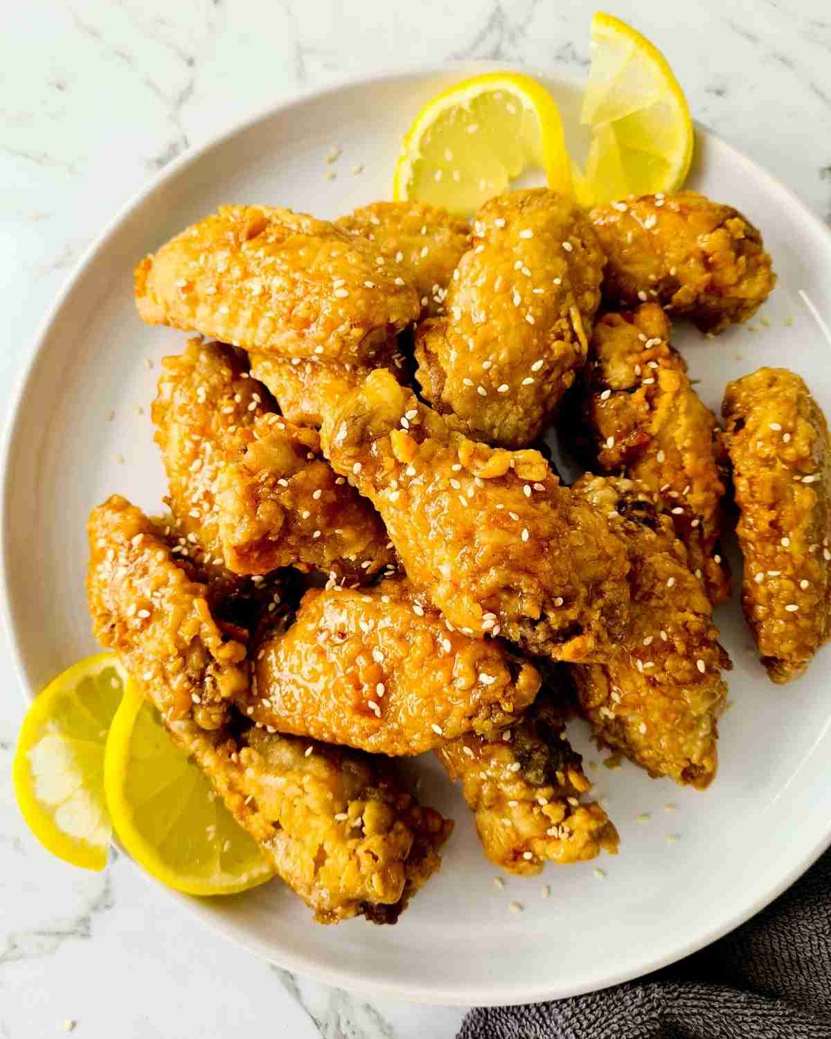 Crispy chicken wings on a white plate