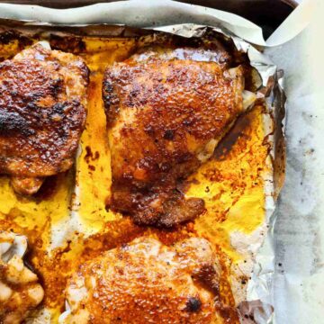 A tray of baked chicken thighs